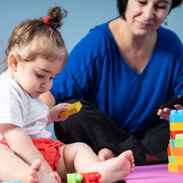 baby playing with building blocks